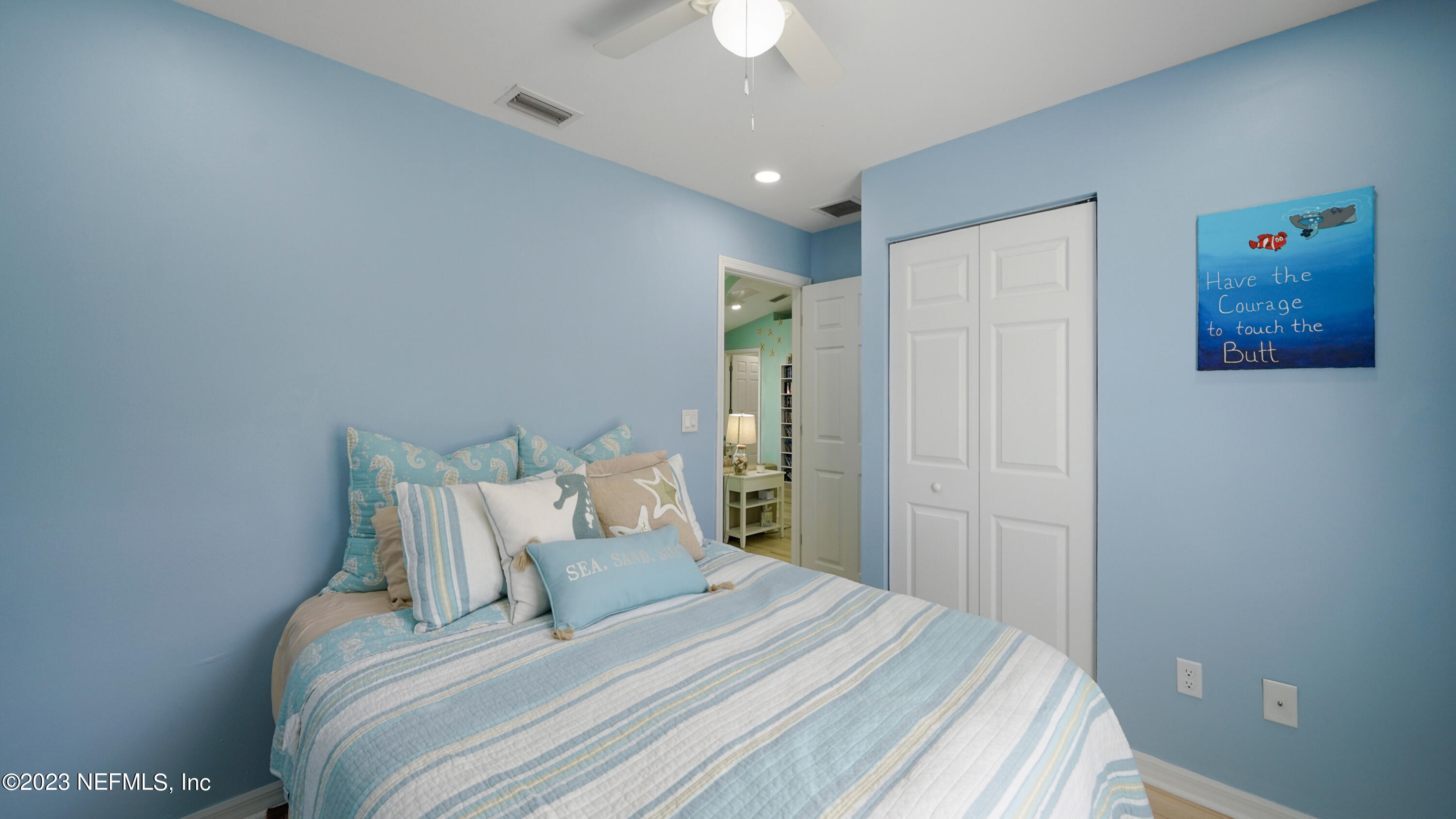 321 West Jayce Way St. Augustine, FL 32084 - Photo 19 of 34 a bedroom with a bed and a chandelier