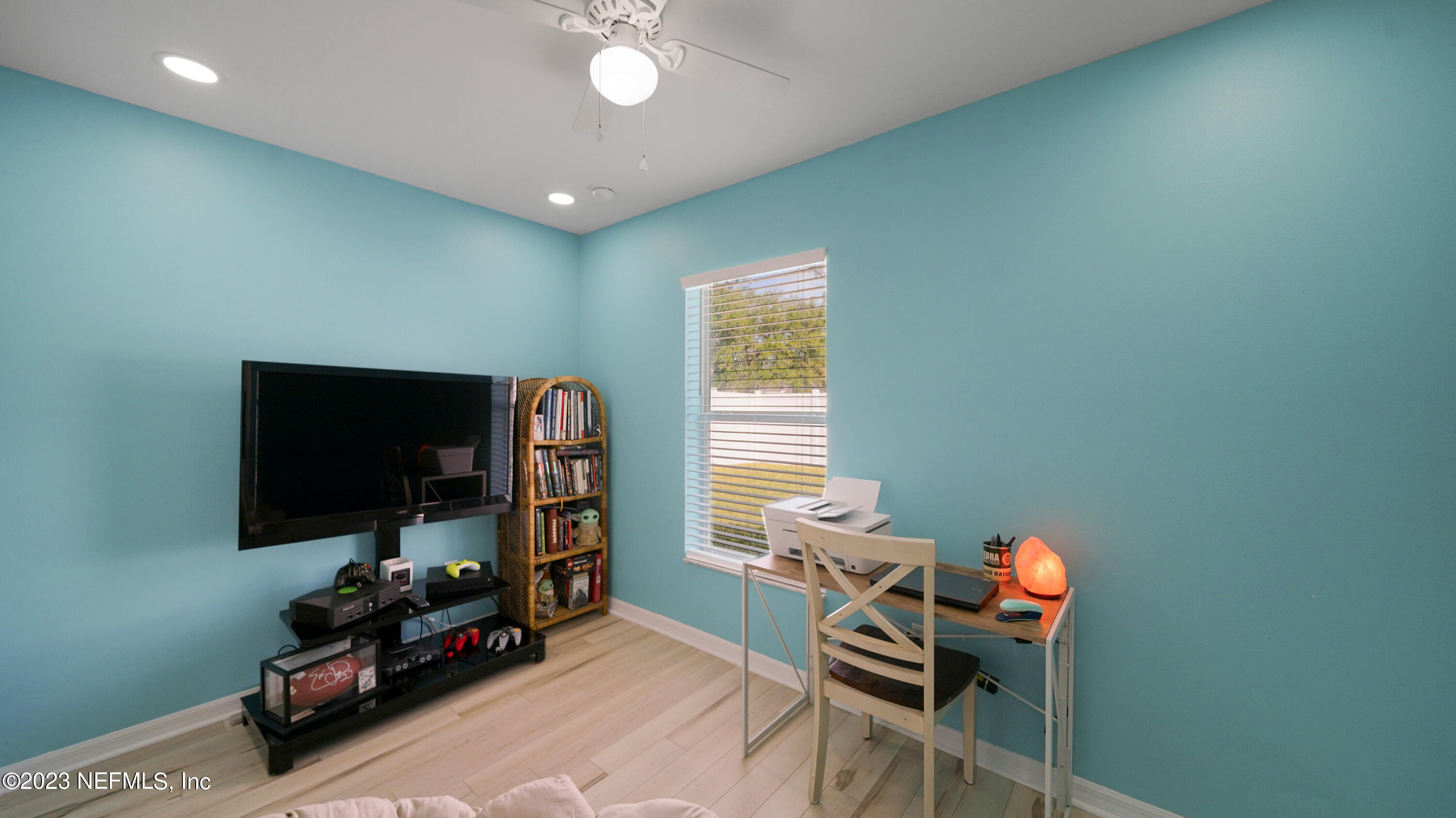 321 West Jayce Way St. Augustine, FL 32084 - Photo 22 of 34 a living room with furniture and a flat screen tv