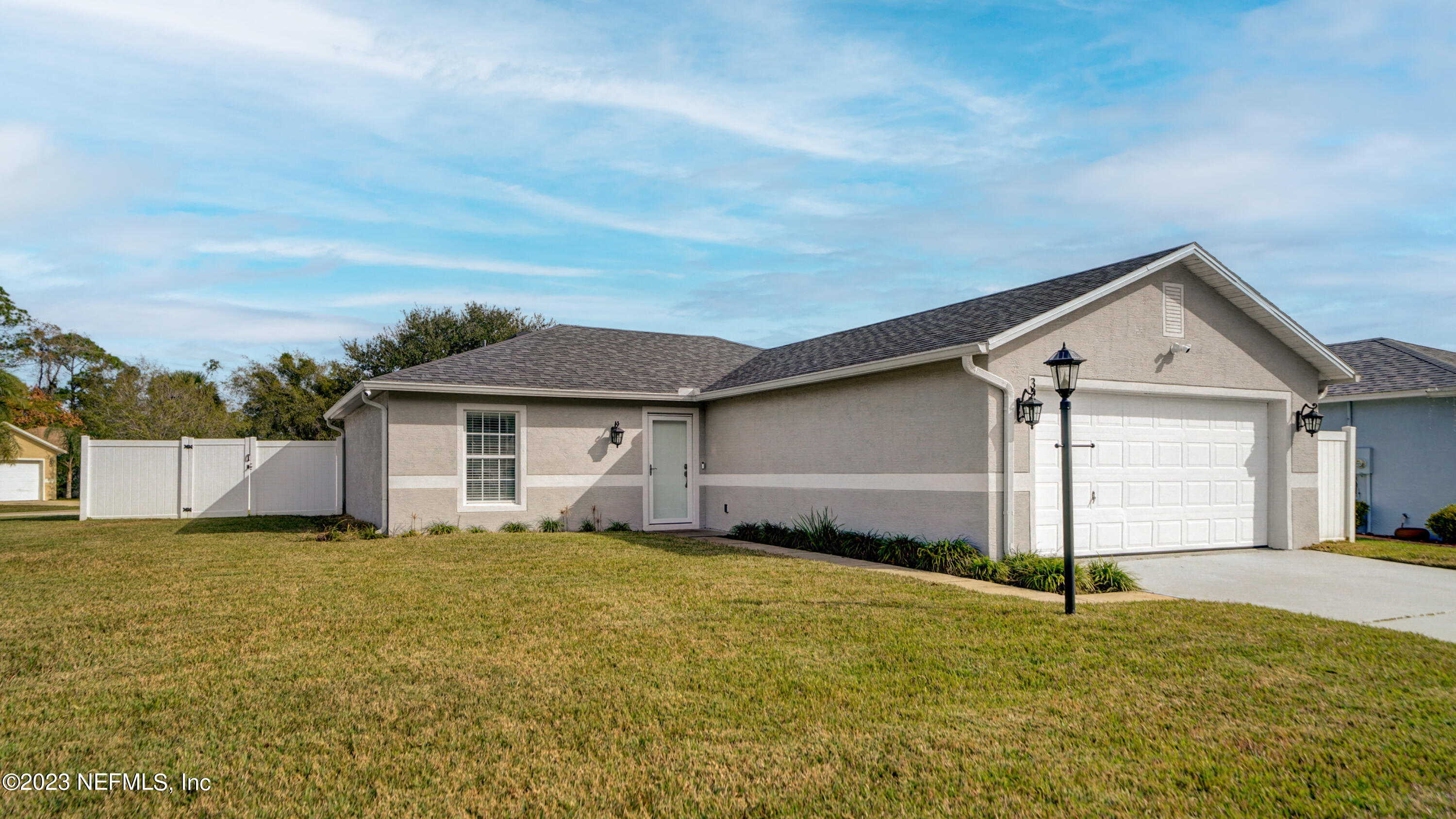 321 West Jayce Way St. Augustine, FL 32084 - Photo 30 of 34 a view of a house with a yard