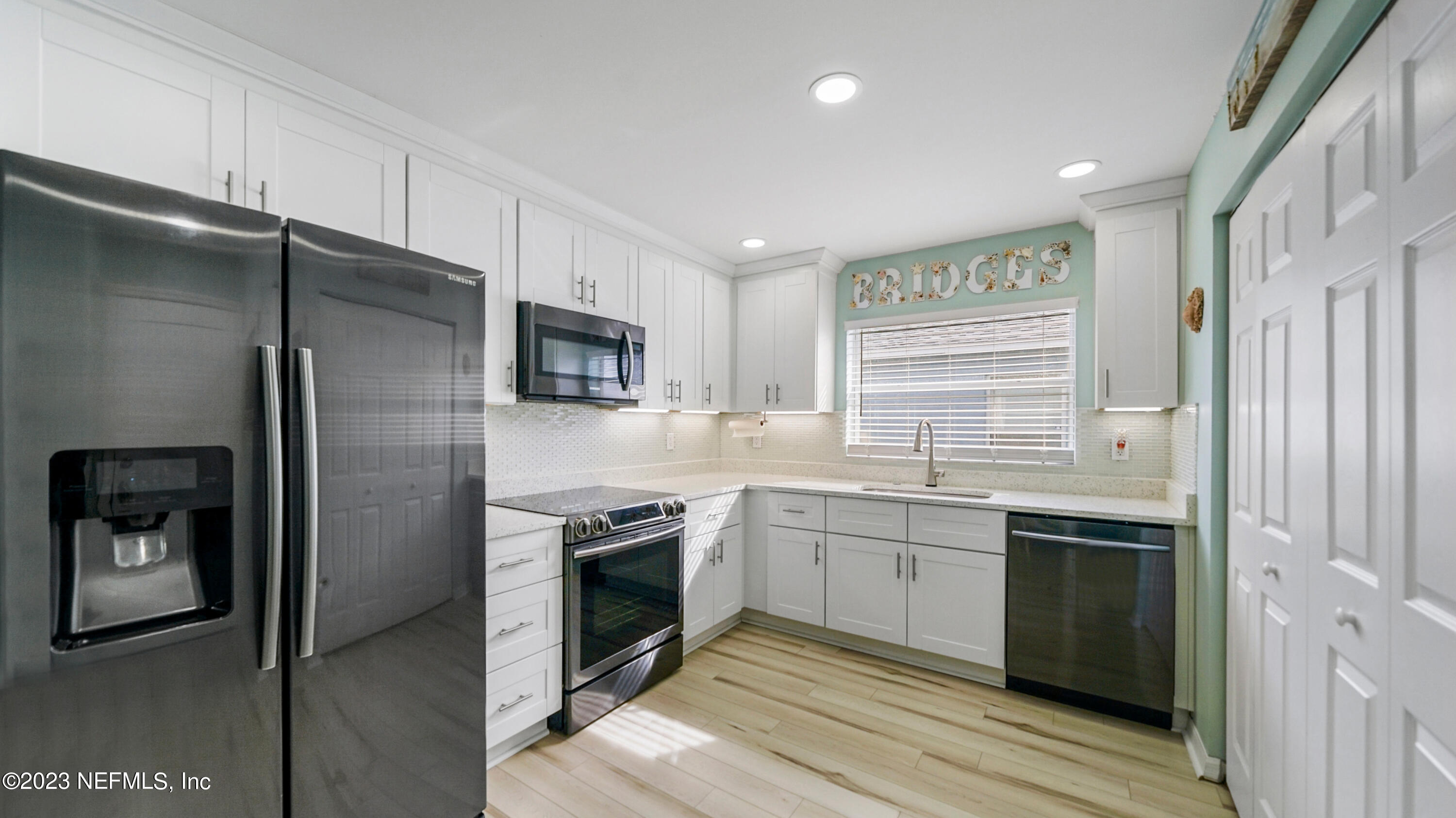 321 West Jayce Way St. Augustine, FL 32084 - Photo 9 of 34 a kitchen with stainless steel appliances granite countertop a refrigerator a stove and a sink