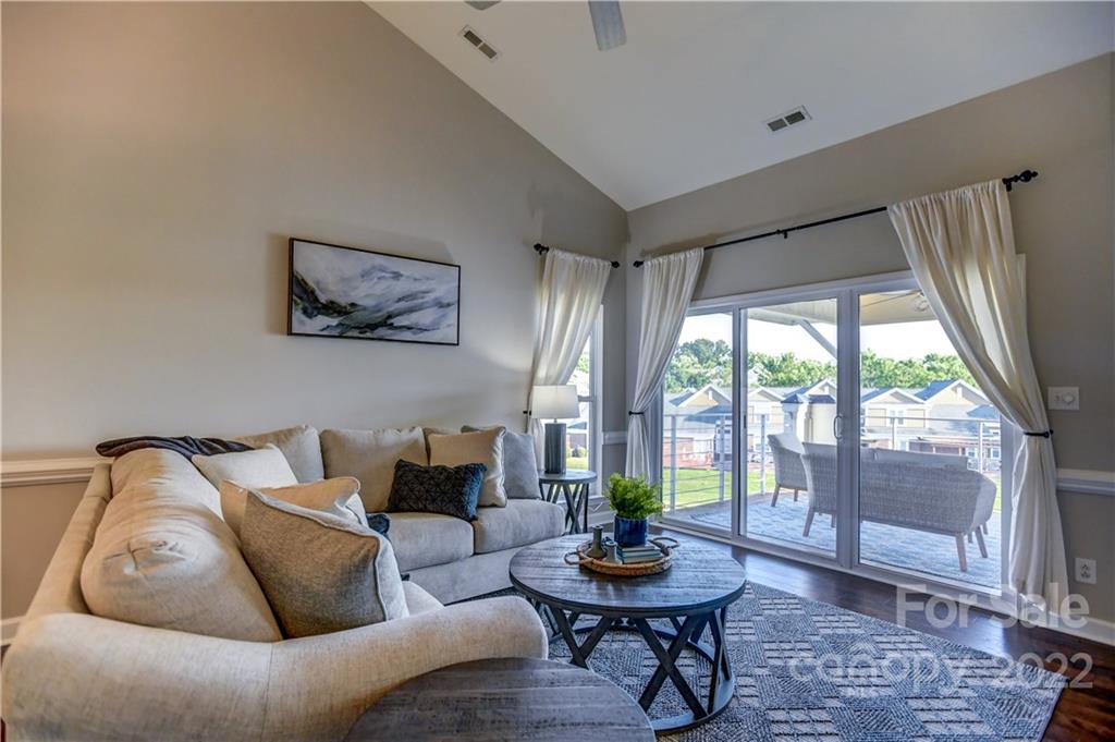 18537 Harborside Drive, Unit 9 Cornelius, NC 28031 - Photo 2 of 14 a living room with furniture and a window