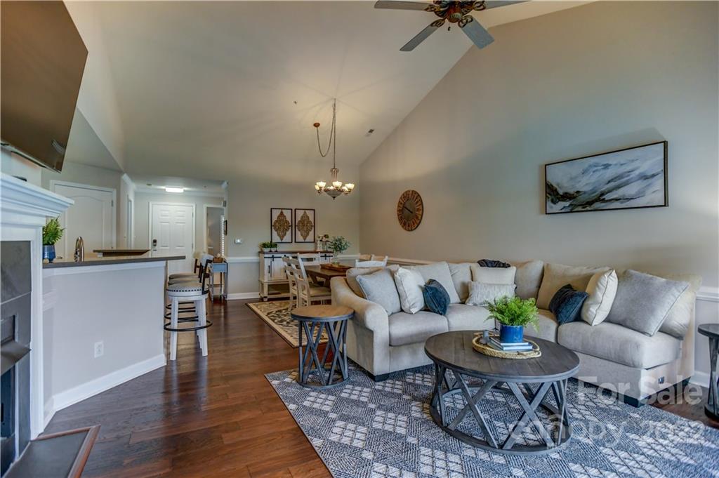 18537 Harborside Drive, Unit 9 Cornelius, NC 28031 - Photo 3 of 14 a living room with furniture and a wooden floor