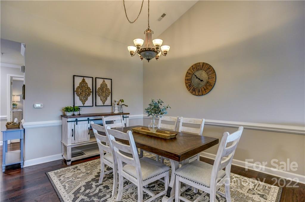 18537 Harborside Drive, Unit 9 Cornelius, NC 28031 - Photo 7 of 14 a view of a dining room with furniture and wooden floor