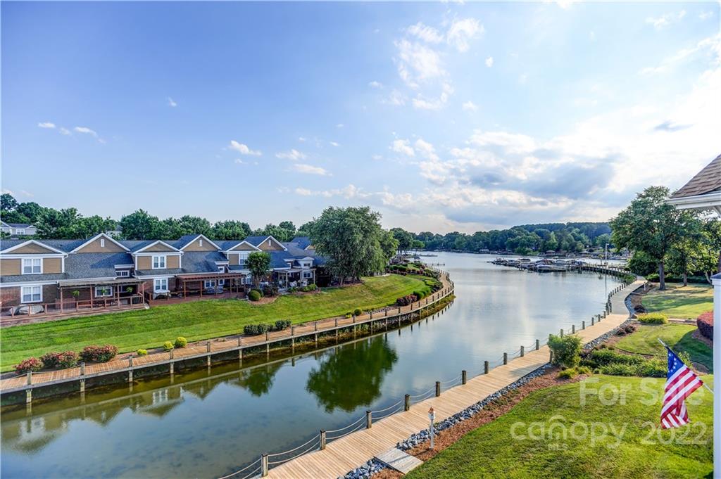18537 Harborside Drive, Unit 9 Cornelius, NC 28031 - Photo 8 of 14 an aerial view of a house with a garden and lake view