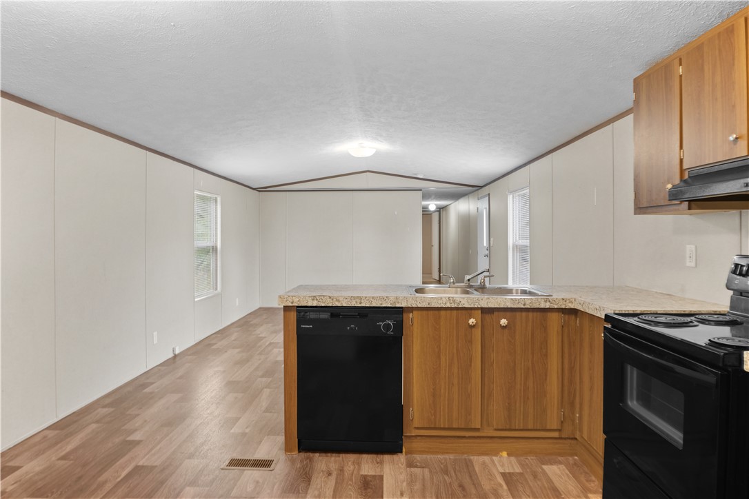 1188 Old Liberty Road Easley, SC 29640 - Photo 16 of 28 This spacious kitchen offers a functional layout with ample counter space and abundant natural light.