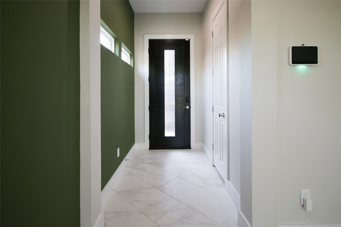 5113 Hershe Street, Unit B Houston, TX 77020 - Photo 3 of 44 a view of a hallway with wooden shelves