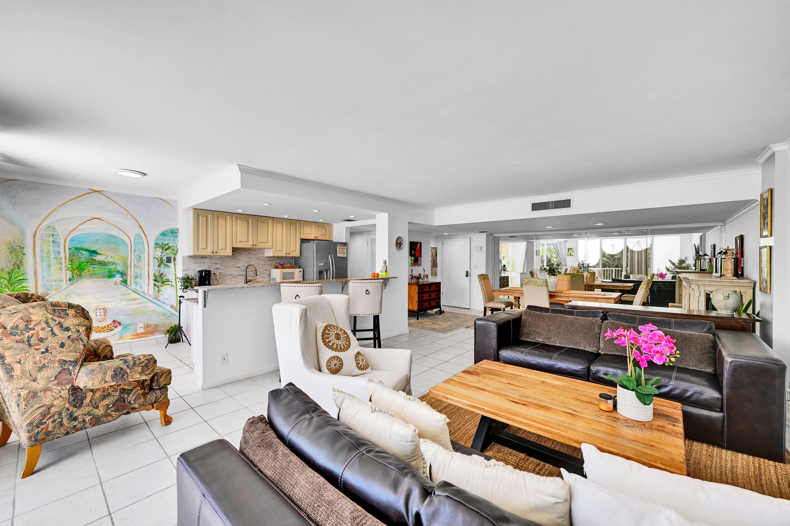 2860 South Ocean Boulevard, Unit 208 Palm Beach, FL 33480 - Photo 8 of 18 a living room with furniture and a dining table with kitchen view