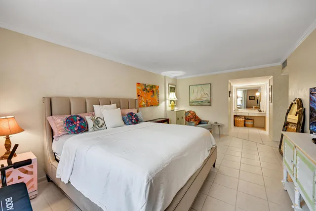 a bed room with a bed and a view of bedroom