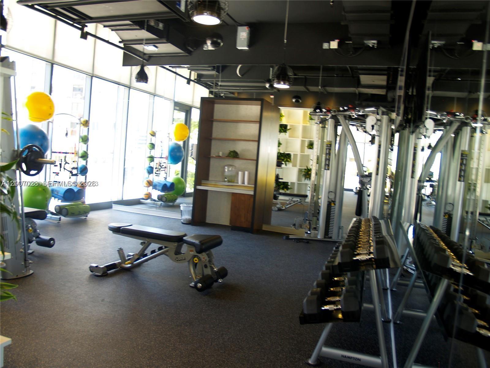 55 Southwest 9th Street, Unit 2502 Miami, FL 33130 - Photo 26 of 27 a view of a room with gym equipment