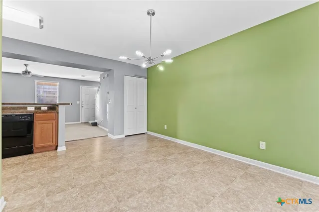 a kitchen with stainless steel appliances granite countertop a refrigerator stove and sink