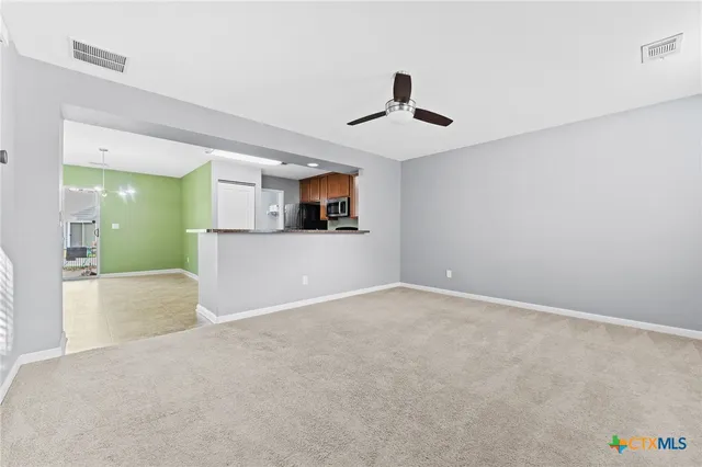 a view of a kitchen with a sink and a microwave