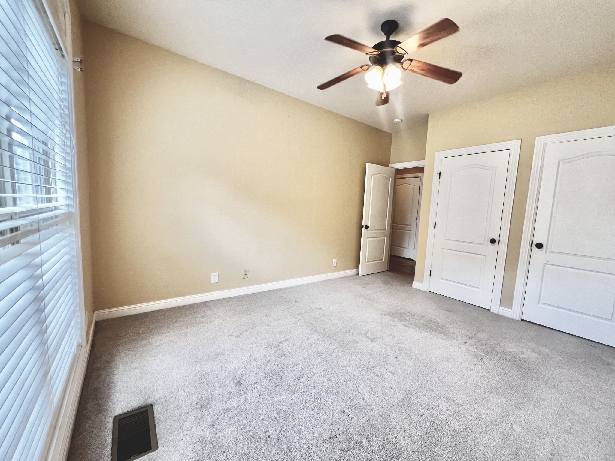 102 Spring View Place Cottontown, TN 37048 - Photo 14 of 40 a view of a room with a ceiling fan and a window