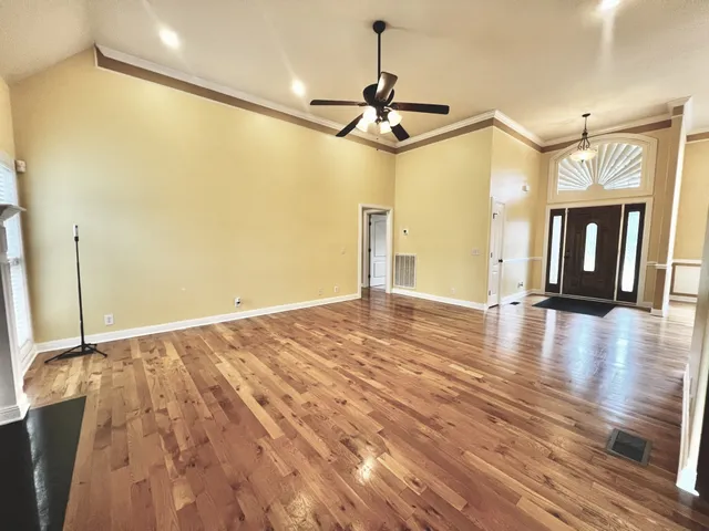 a view of a living room with hardwood floor