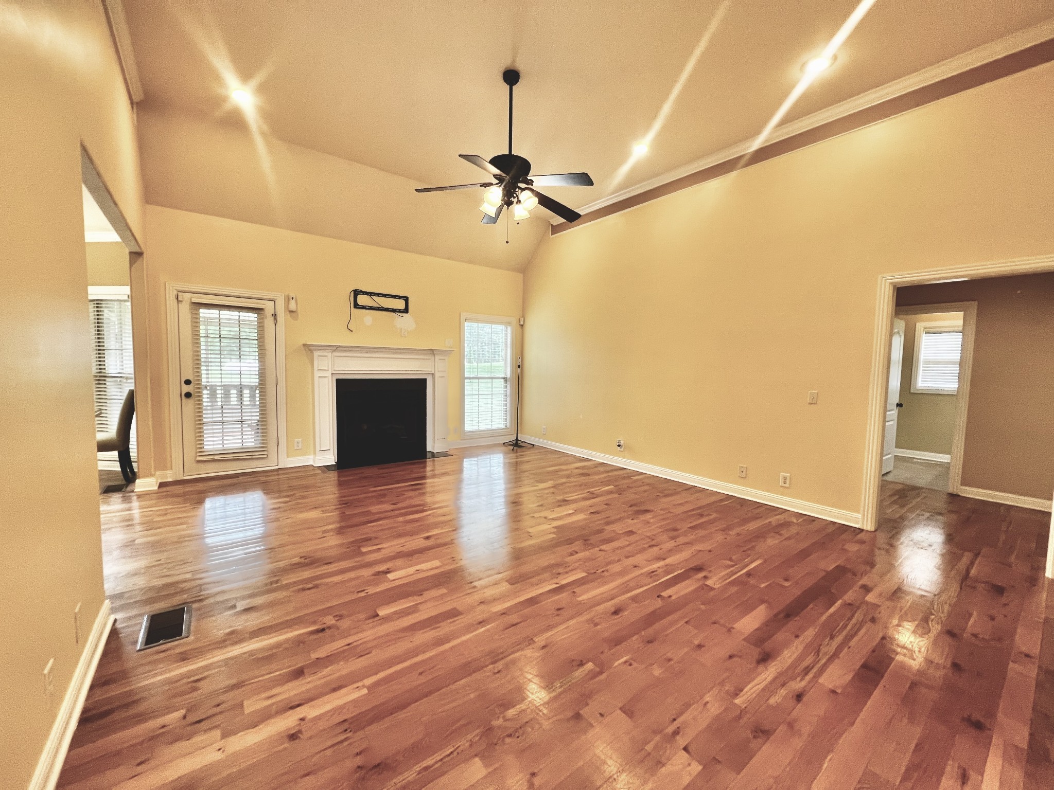 102 Spring View Place Cottontown, TN 37048 - Photo 22 of 40 a view of a livingroom with wooden floor and a ceiling fan