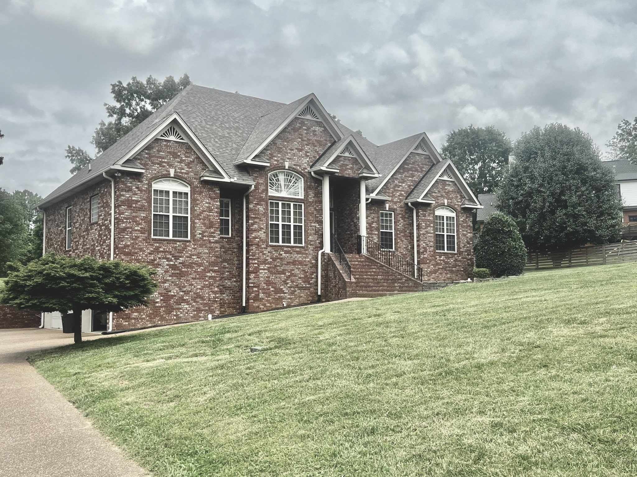 102 Spring View Place Cottontown, TN 37048 - Photo 36 of 40 a view of a house with a yard and potted plants
