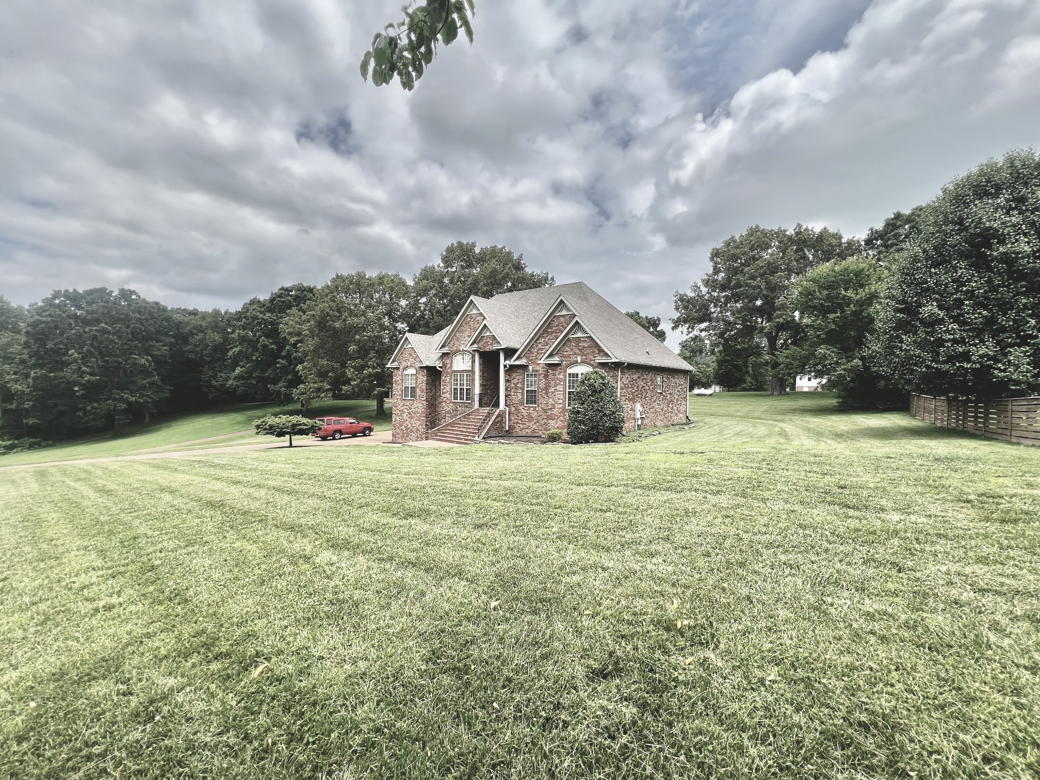 102 Spring View Place Cottontown, TN 37048 - Photo 39 of 40 a view of a houses with yard and large trees