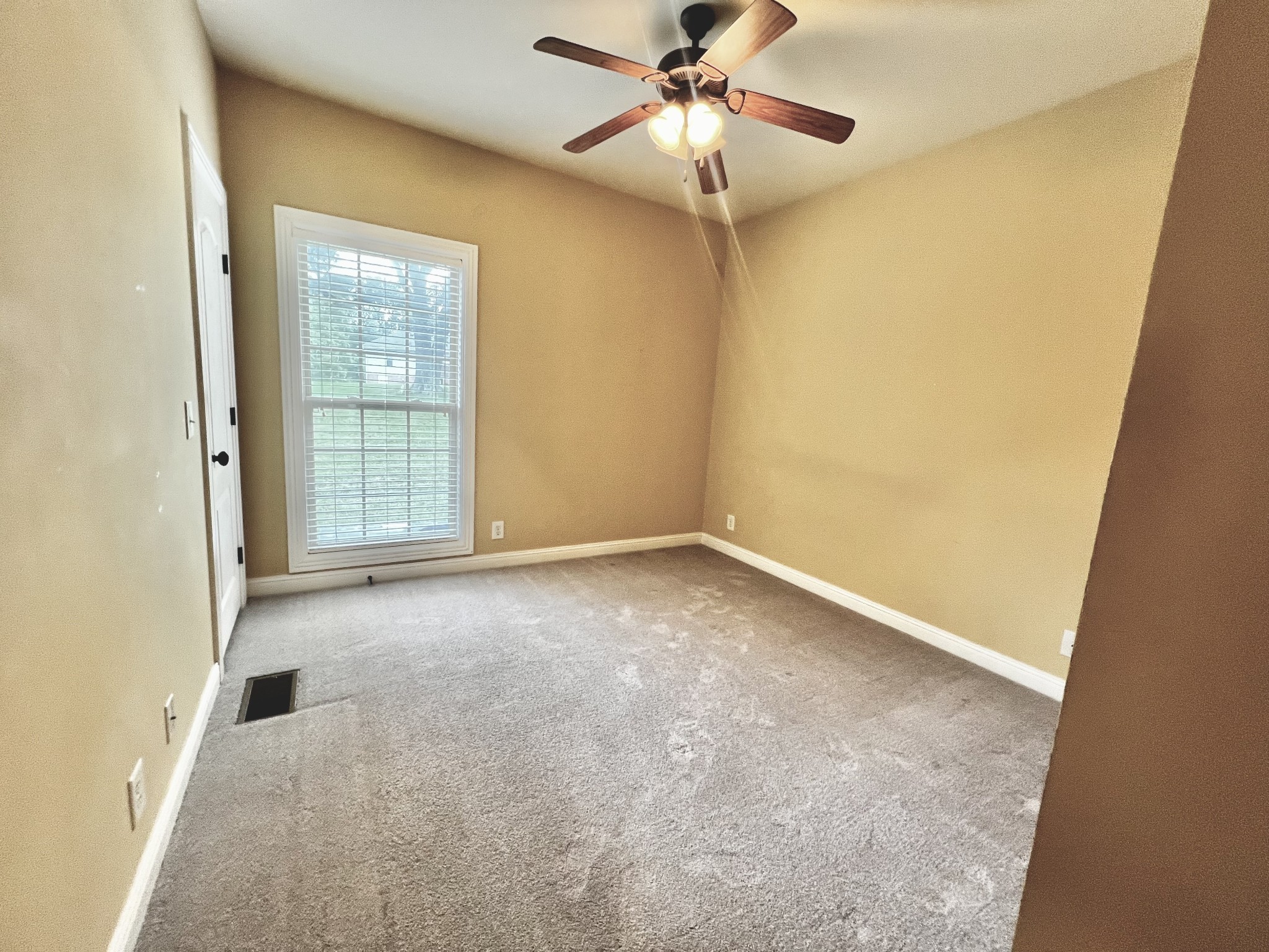 102 Spring View Place Cottontown, TN 37048 - Photo 9 of 40 an empty room with windows and fan