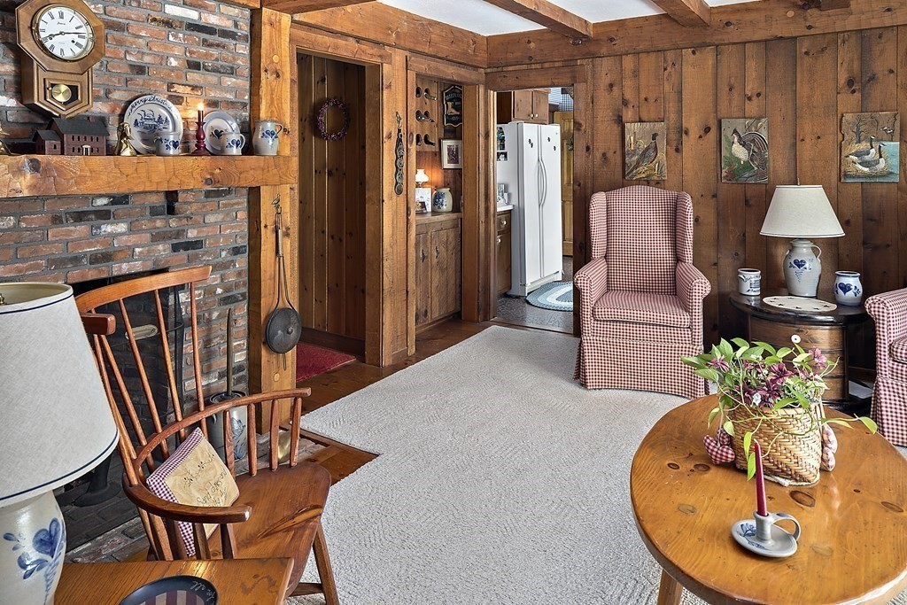 98 Plain Street Middleboro, MA 02346 - Photo 12 of 25 a living room with furniture a rug and a chandelier