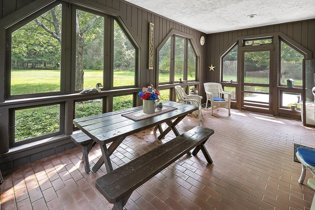 98 Plain Street Middleboro, MA 02346 - Photo 13 of 25 a living room with furniture and a floor to ceiling window