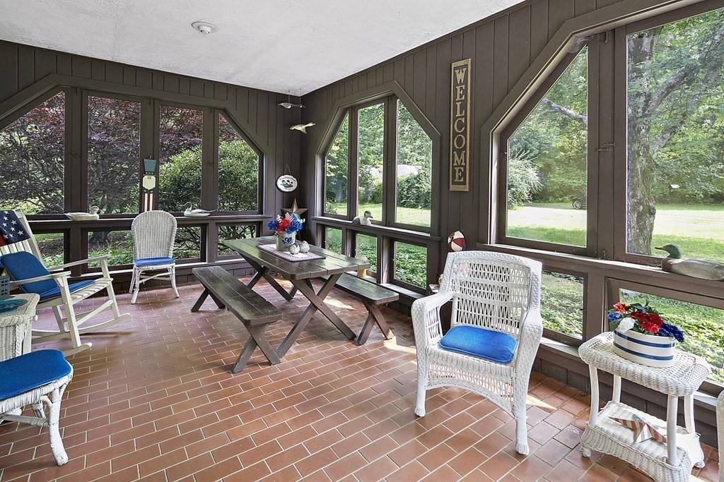 98 Plain Street Middleboro, MA 02346 - Photo 14 of 25 a living room with furniture and a floor to ceiling window