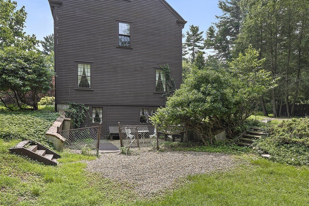 98 Plain Street Middleboro, MA 02346 - Photo 15 of 25 a front view of a house with garden