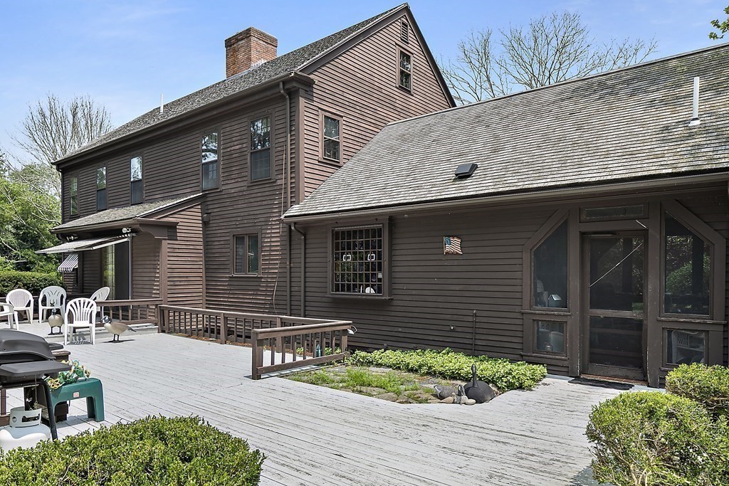 98 Plain Street Middleboro, MA 02346 - Photo 17 of 25 a front view of house with a yard and potted plants