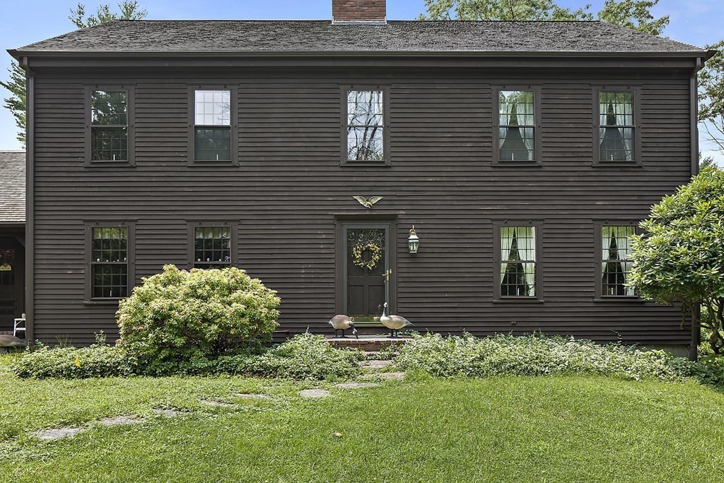98 Plain Street Middleboro, MA 02346 - Photo 18 of 25 a front view of a house with garden