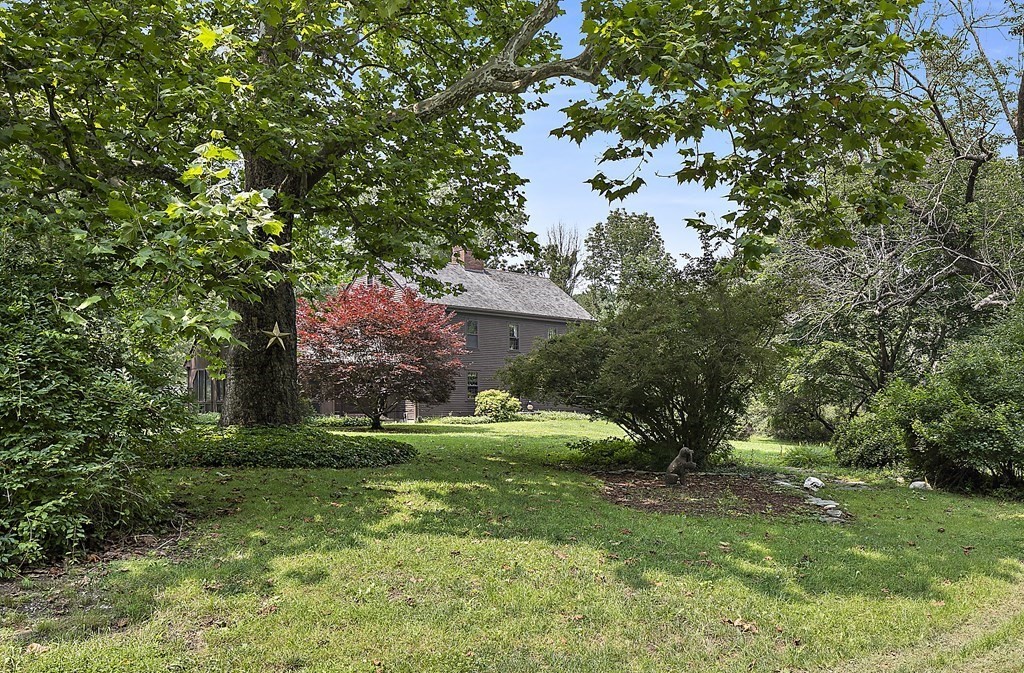 98 Plain Street Middleboro, MA 02346 - Photo 21 of 25 a view of a house with a tree in a yard