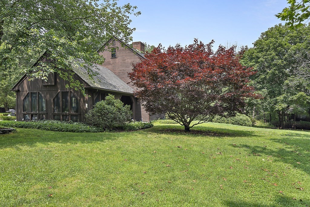 98 Plain Street Middleboro, MA 02346 - Photo 4 of 25 a view of a house with a big yard and large trees