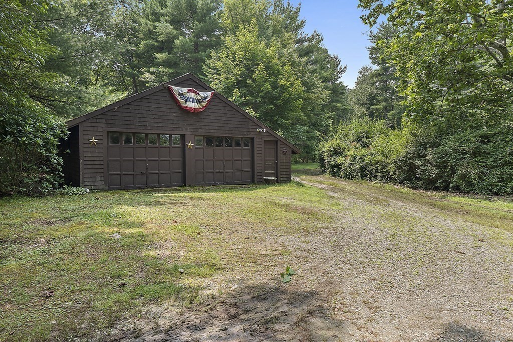 98 Plain Street Middleboro, MA 02346 - Photo 6 of 25 a front view of a house with a yard