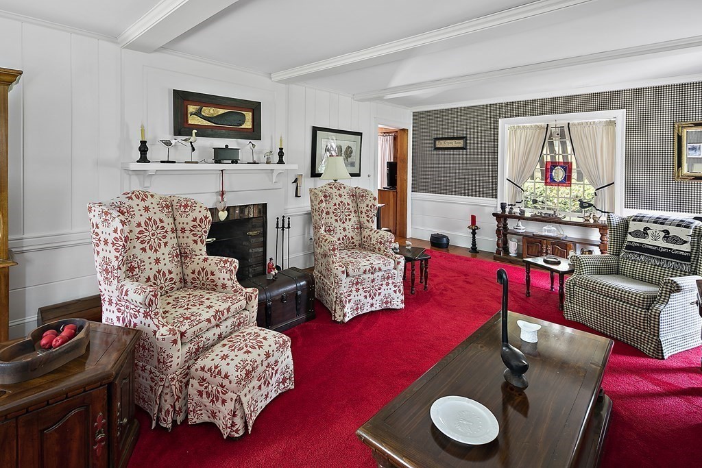 98 Plain Street Middleboro, MA 02346 - Photo 8 of 25 a living room with furniture and a fireplace