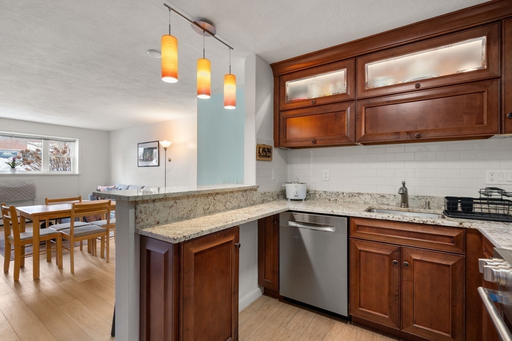 a kitchen with a stove a sink and a microwave