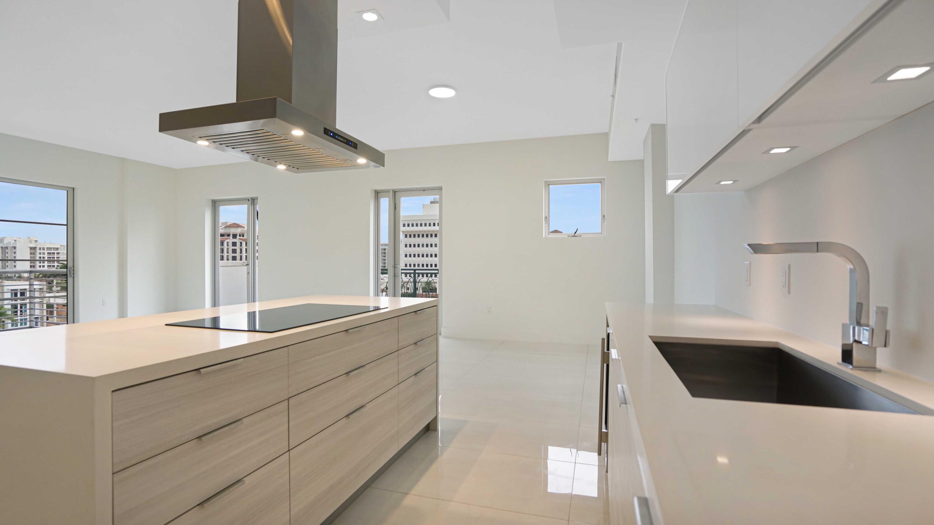 155 East Boca Raton Road, Unit 620 Boca Raton, FL 33432 - Photo 11 of 79 a kitchen with stainless steel appliances granite countertop a sink and a refrigerator