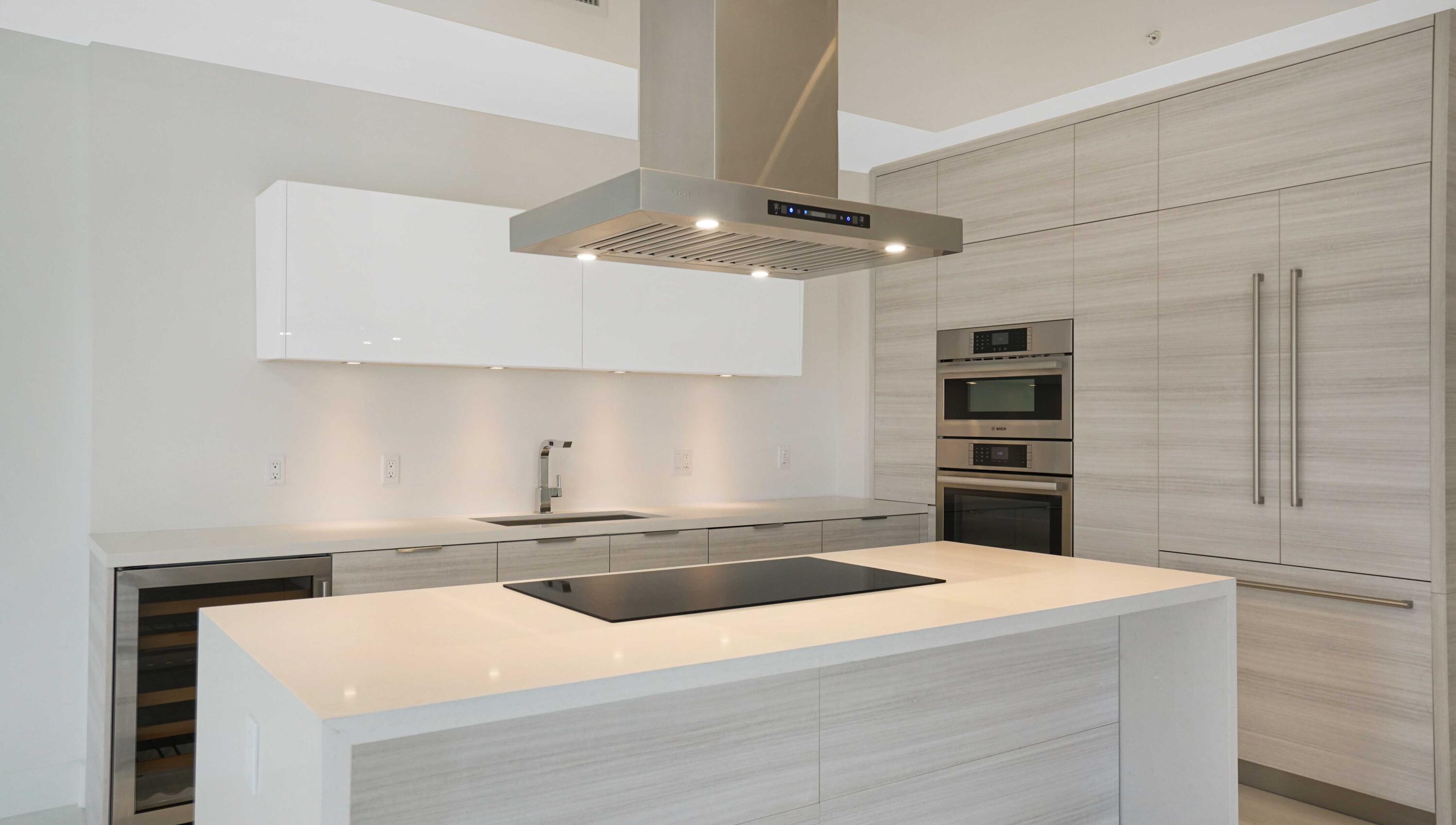 155 East Boca Raton Road, Unit 620 Boca Raton, FL 33432 - Photo 13 of 79 a kitchen with stainless steel appliances a sink and a refrigerator