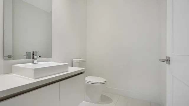 a kitchen with a sink and a stove