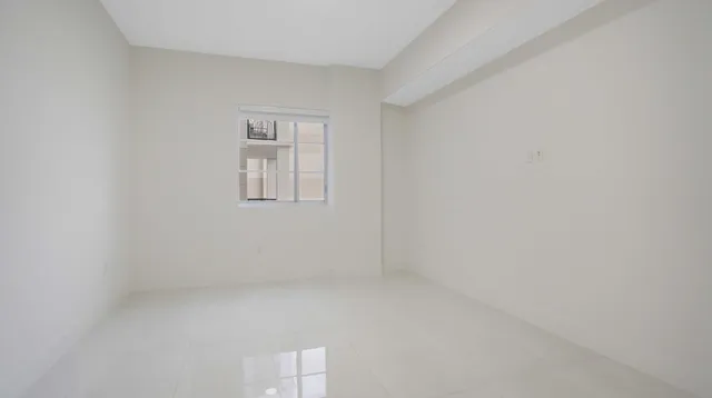 a bathroom with a glass door shower