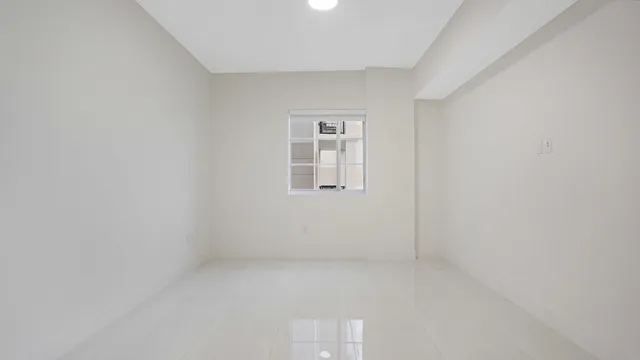 a room with stainless steel appliances kitchen island a table and chairs in it