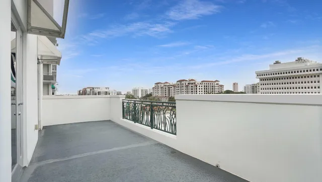 a kitchen with kitchen island a sink and a large window