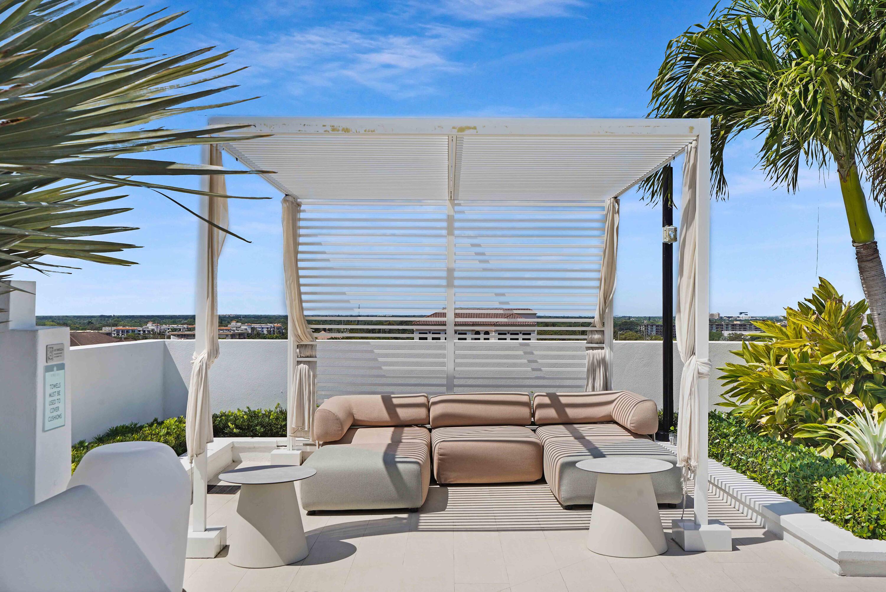 155 East Boca Raton Road, Unit 620 Boca Raton, FL 33432 - Photo 40 of 79 a view of a patio with couches and potted plants
