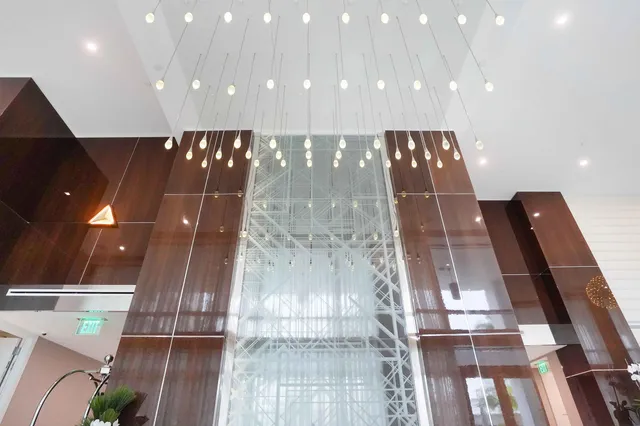 a kitchen with a sink stainless steel appliances and cabinets