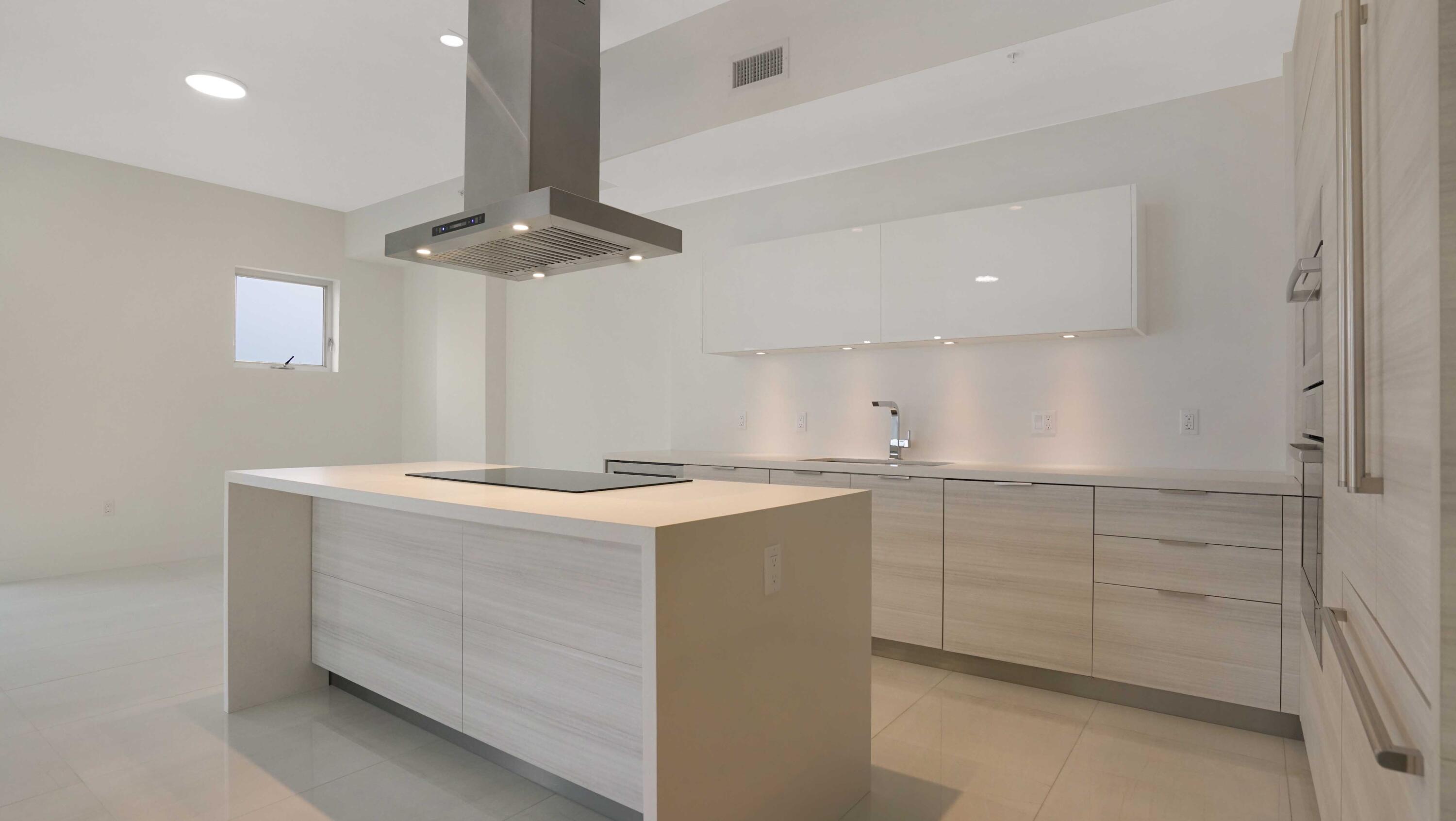 155 East Boca Raton Road, Unit 620 Boca Raton, FL 33432 - Photo 5 of 79 a kitchen with a stove cabinets and chandelier