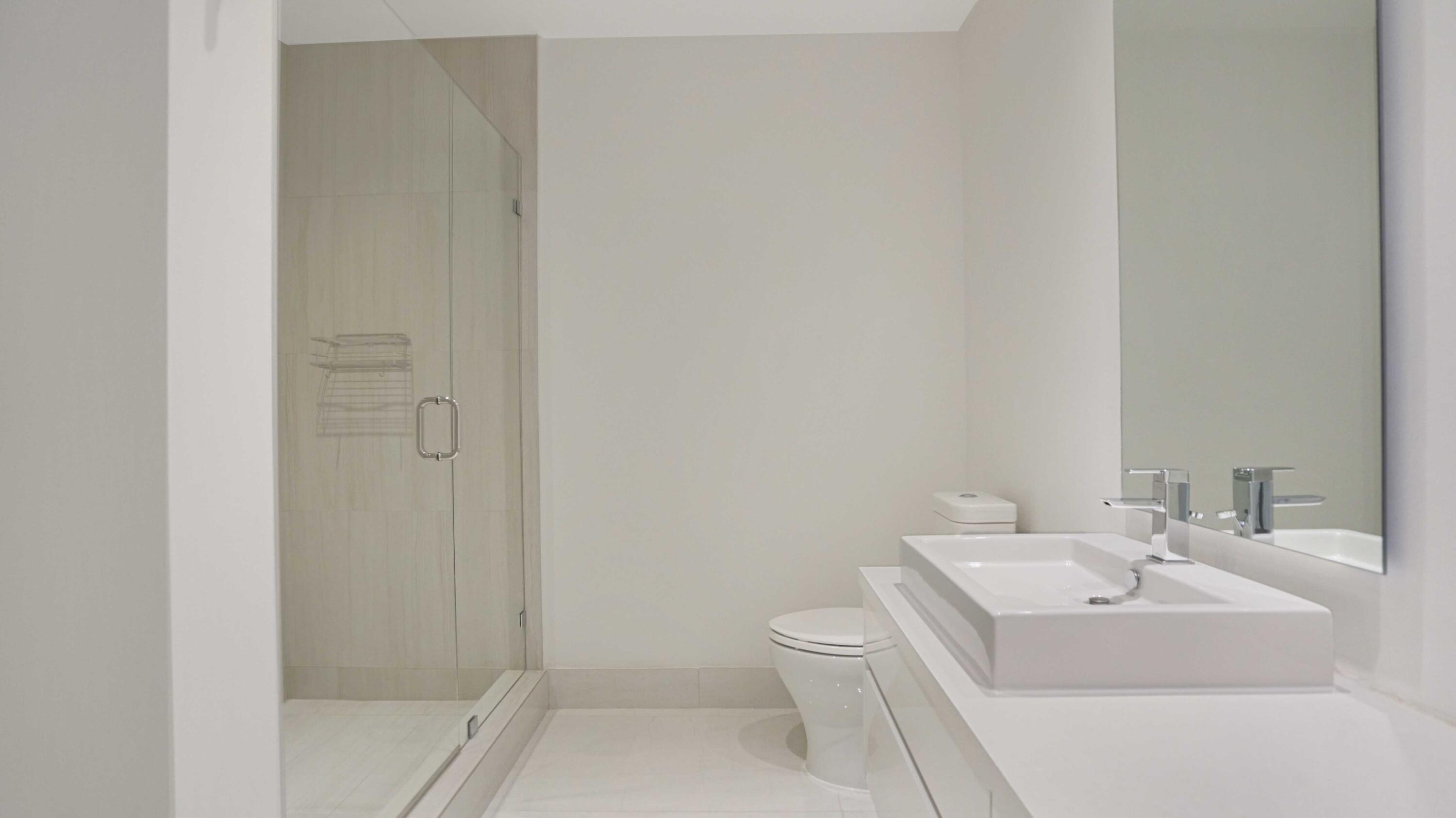 155 East Boca Raton Road, Unit 620 Boca Raton, FL 33432 - Photo 72 of 79 a bathroom with a sink a toilet and shower