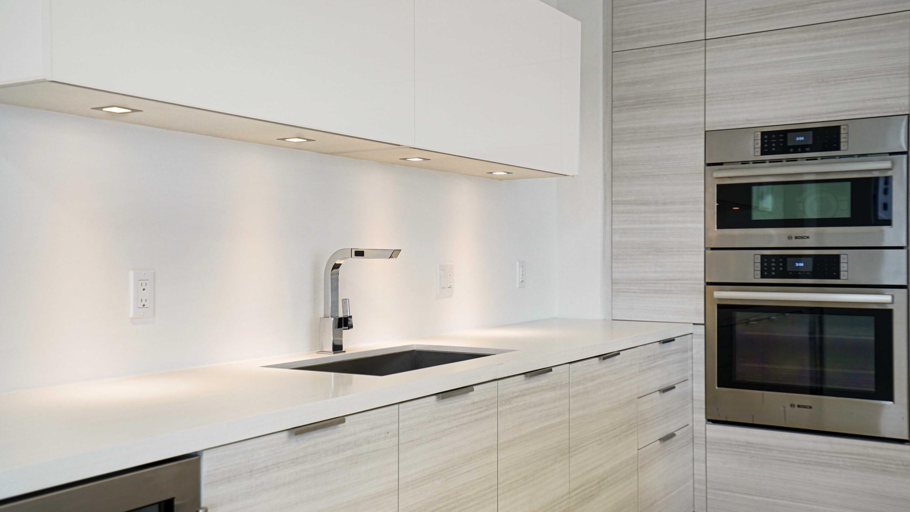 155 East Boca Raton Road, Unit 620 Boca Raton, FL 33432 - Photo 76 of 79 a kitchen with a sink stainless steel appliances and cabinets