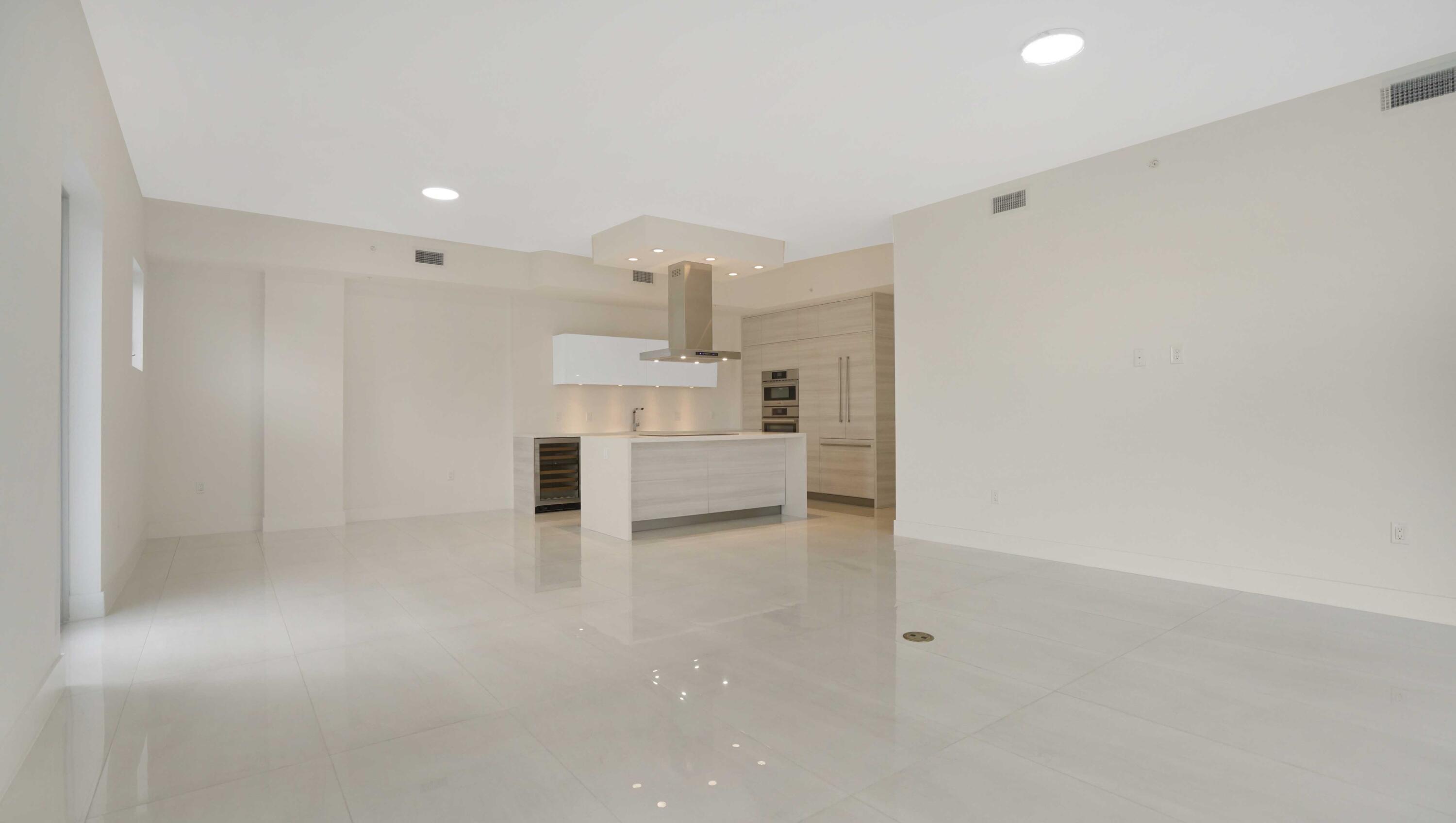 155 East Boca Raton Road, Unit 620 Boca Raton, FL 33432 - Photo 8 of 79 a view of a kitchen with white cabinets and a sink