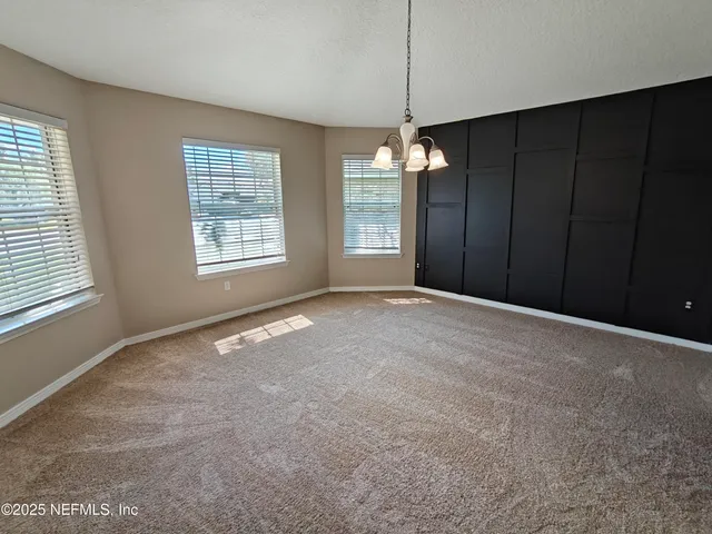 a view of a livingroom with a chandelier