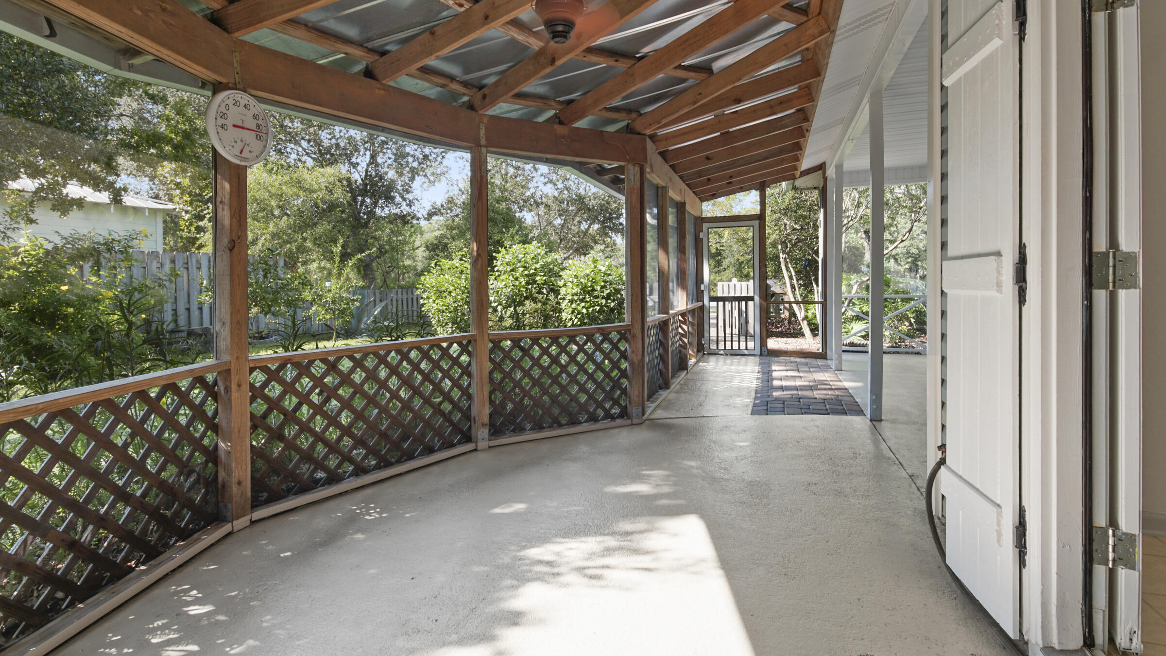 148 Ash Street Santa Rosa Beach, FL 32459 - Photo 13 of 41 a view of a porch with wooden floor and outdoor space