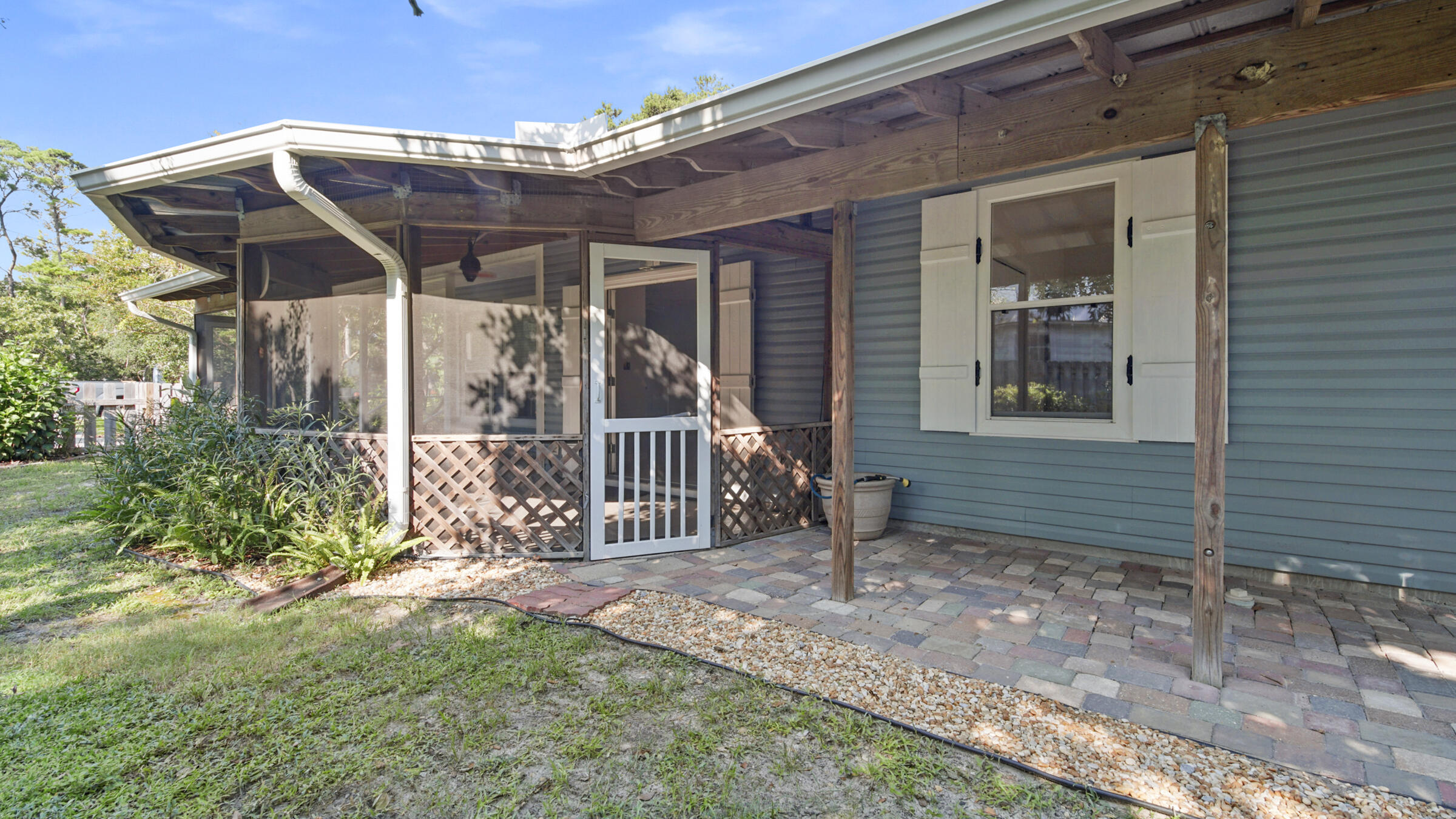 148 Ash Street Santa Rosa Beach, FL 32459 - Photo 14 of 41 a view of a house with backyard and porch