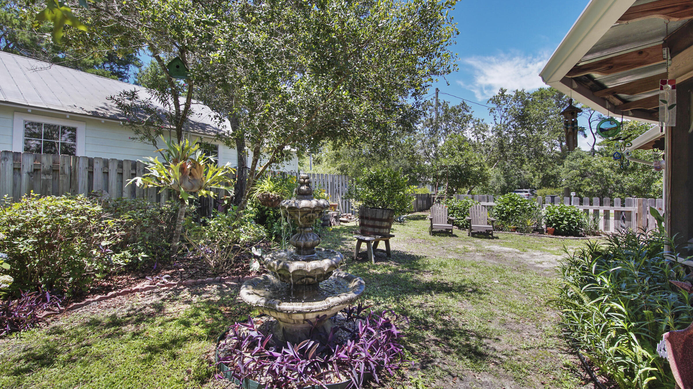 148 Ash Street Santa Rosa Beach, FL 32459 - Photo 9 of 41 a view of a chair and tables in the patio