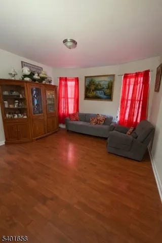 a living room with furniture window and flat screen tv