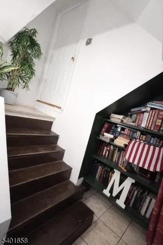 a view of staircase with white walls